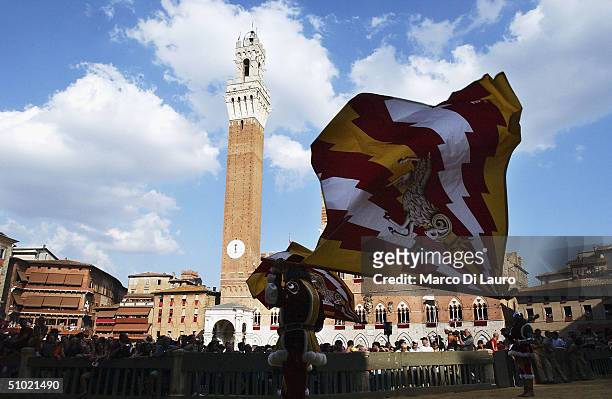Two standard bearers belonging to the Valdimontone , one of the seventeen contrade or neighboroods, perform the flag waving display during the...