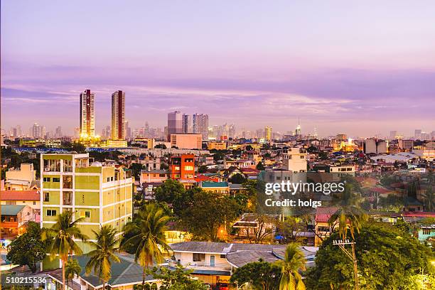 view of quezon city skyline during sunset - quezon city stock pictures, royalty-free photos & images