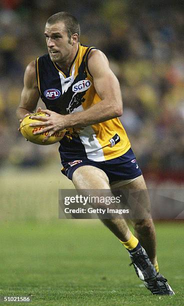 Chris Judd of the Eagles in action during the round fourteen AFL match between the West Coast Eagles and Geelong at Subiaco Oval July 03, 2004 in...