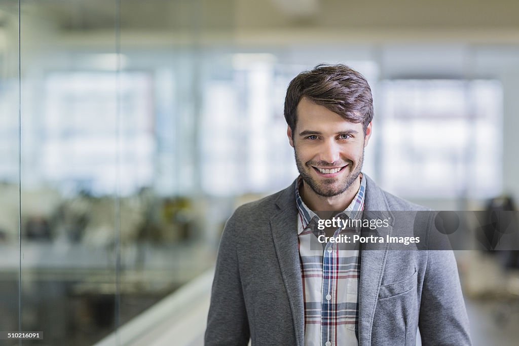 Happy businessman in creative office