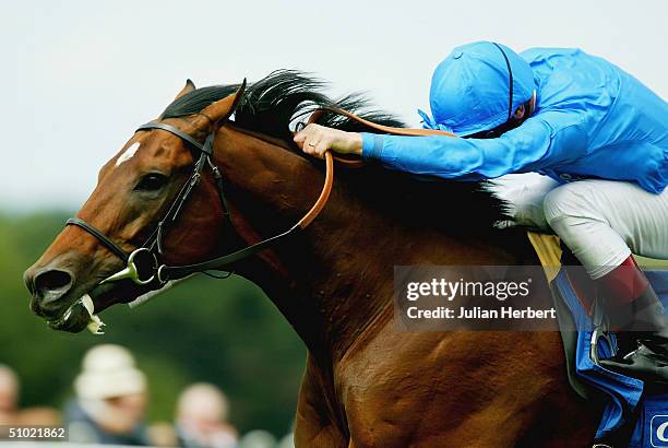 Frankie Dettori and the Godolphin trained Refuse To Bend come out of the pack to land The Coral-Eclipse Stakes Race run at Sandown Racecourse on July...