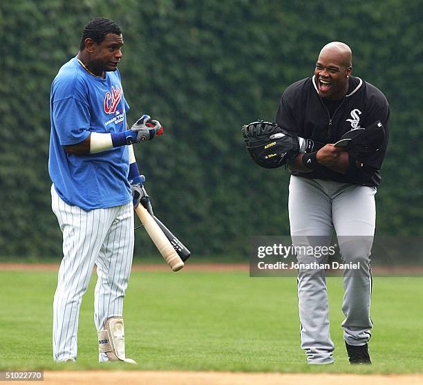 Sammy Sosa of the Chicago Cubs and Frank Thomas of the Chicago White Sox joke during batting practice before a game bewteen the Cubs and the White...