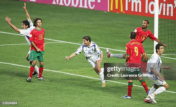 Angelos Charisteas of Greece celebrates scoring their first goal during the UEFA Euro 2004 Final match between Portugal and Greece at the Luz Stadium...