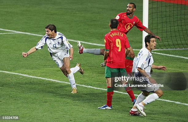 Angelos Charisteas of Greece celebrates scoring their first goal during the UEFA Euro 2004 Final match between Portugal and Greece at the Luz Stadium...