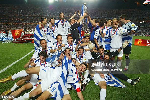 Greece celebrate with the trophy after winning the UEFA Euro 2004, Final match between Portugal and Greece at the Luz Stadium on July 4, 2004 in...