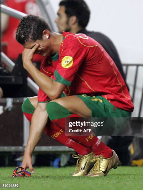 Portuguese forward Cristiano Ronaldo cries, 04 July 2004 at the Luz stadium in Lisbon after the Euro 2004 final football match between Portugal and...