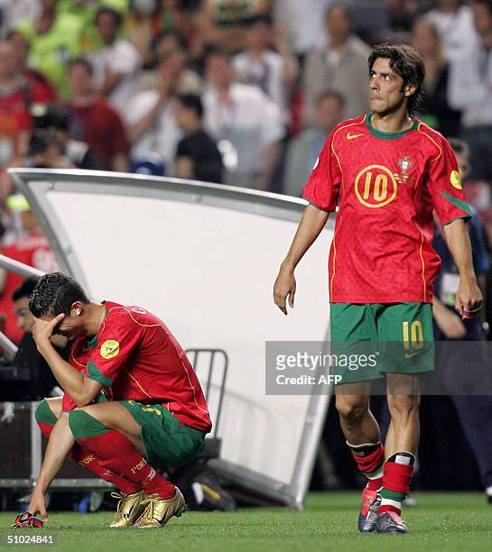 Portuguese forward Cristiano Ronaldo cries as midfielder Rui Costa looks dejected, 04 July 2004 at the Luz stadium in Lisbon after the Euro 2004...