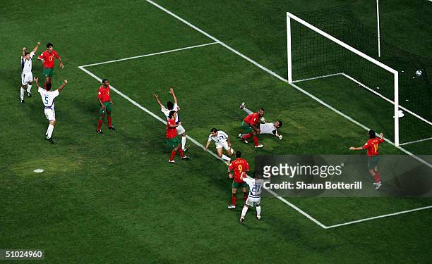 Angelos Charisteas of Greece scores their winning goal during the UEFA Euro 2004 Final match between Portugal and Greece at the Luz Stadium on July...