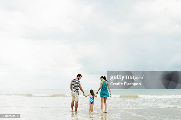 family day out at the beach - couple sea uk stock pictures, royalty-free photos & images