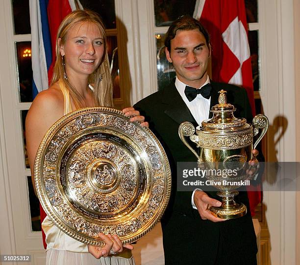 Maria Sharapova of Russia and Roger Federer of Switzerland pose for photographs at the Wimbledon Champions Dinner at the Savoy Hotel on July 4, 2004...