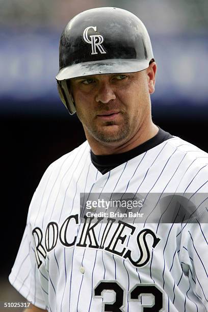 Larry Walker of the Colorado Rockies walks back to the dugout after pinch-hitting against the Detroit Tigers on July 4, 2004 at Coors Field in...