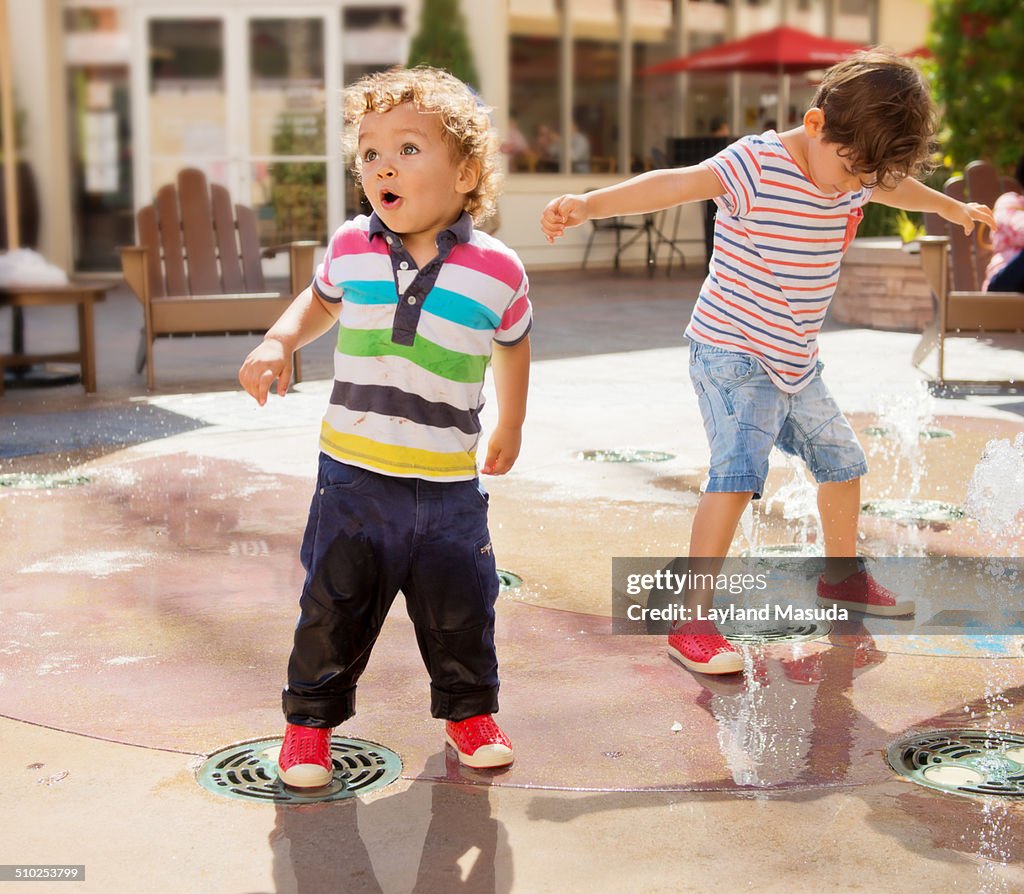 Amazed toddler - water spout fun