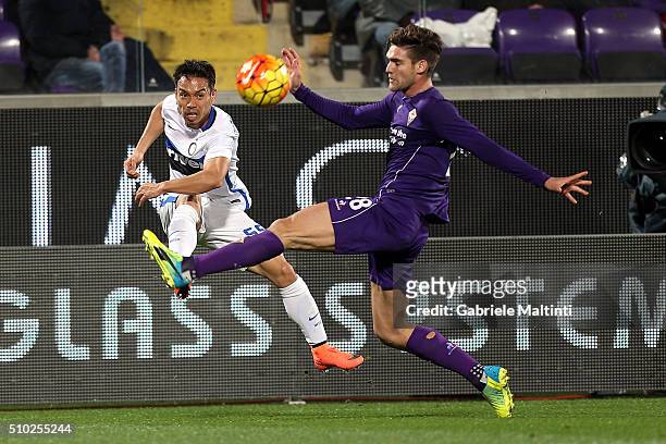 Marcos Aslonso of ACF Fiorentina battles for the ball with Yuto Nagatomo of FC Internazionale Milano during the Serie A match between ACF Fiorentina...