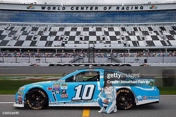 Danica Patrick, driver of the Nature's Bakery Chevrolet, poses with her car after qualifying for the NASCAR Sprint Cup Series Daytona 500 at Daytona...