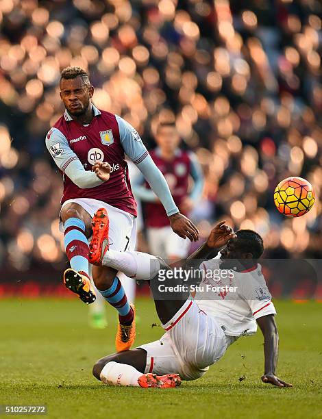 Mamadou Sakho of Liverpool challenges Leandro Bacuna of Aston Villa during the Barclays Premier League match between Aston Villa and Liverpool at...