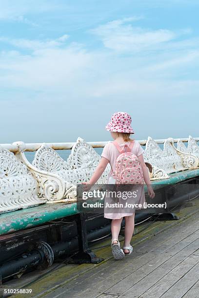 girl walking along pier - look back at blackpool stock pictures, royalty-free photos & images