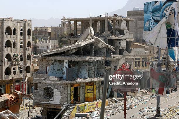 Damaged cars and buildings are seen after forces loyal to President of Yemen Abd Rabbuh Mansur Hadi captured Hasab neighborhood following clashes...