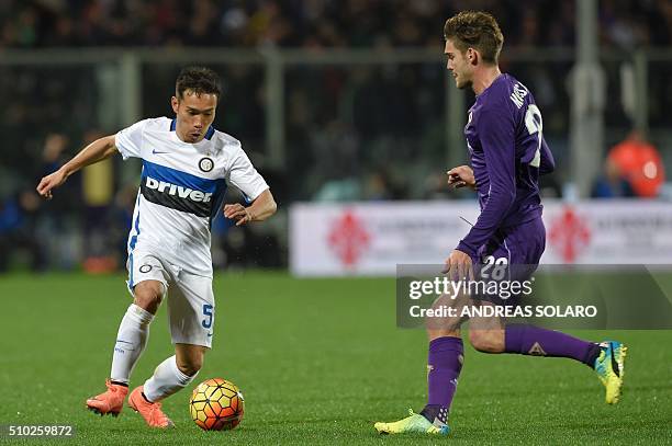 Inter Milan's defender from Japan Yuto Nagatomo fights for the ball with Fiorentina's defender from Spain Marcos Alonso Mendoza during the Italian...