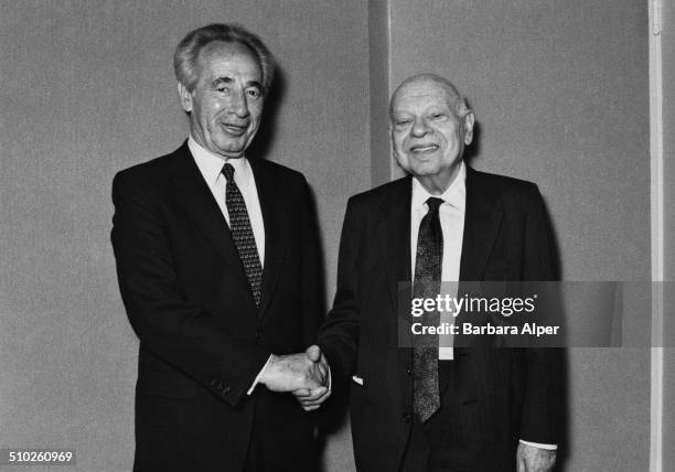 Israeli Foreign Minister Shimon Peres shaking hands with Mr Merkin, 19th May 1988.