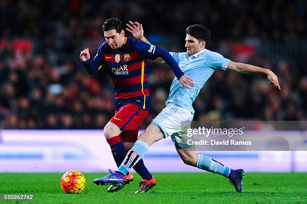 Lionel Messi of FC Barcelona competes for the ball with Carles Planas of RC Celta de Vigo during the La Liga match between FC Barcelona and Celta...