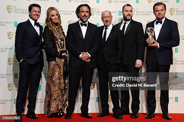 Presenter Tom Cruise poses with Best Film winners Mary Parent, Alejandro Gonzalez Inarritu, Steve Golin, Keith Redmon and Best Actor winner Leonardo...