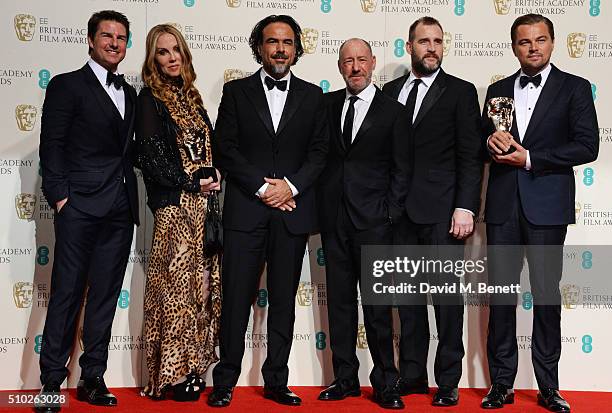 Presenter Tom Cruise poses with Best Film winners Mary Parent, Alejandro Gonzalez Inarritu, Steve Golin, Keith Redmon and Best Actor winner Leonardo...