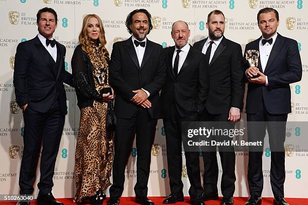 Presenter Tom Cruise poses with Best Film winners Mary Parent, Alejandro Gonzalez Inarritu, Steve Golin, Keith Redmon and Best Actor winner Leonardo...