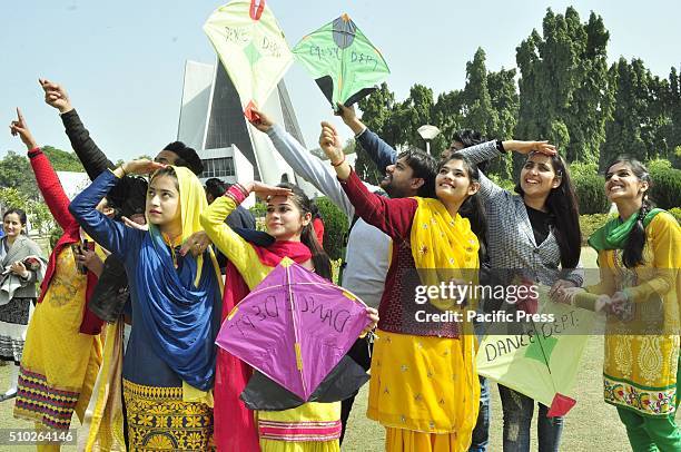 Girls dressed in yellow take part in Kite flying on the occasion of Basant Panchami Festival at Punjabi University. Basant Panchami is a Hindu...