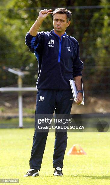 Chelsea Football team's newly appointed Manager Jose Mourinho talk to his players at the training session at Chelsea Football Team's training grounds...