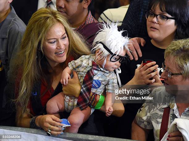 Susan Lomas of Nevada holds her 3-month-old son Oliver Lomas, dressed as Democratic presidential candidate Sen. Bernie Sanders , during his campaign...