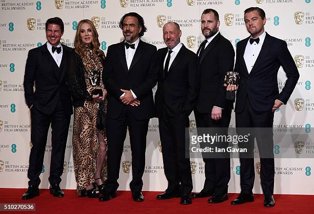 Tom Cruise poses with Best Film winners Mary Parent, Alejandro Gonzalez Inarritu, Steve Golin, Keith Redmon and Best Actor winner Leonardo DiCaprio...