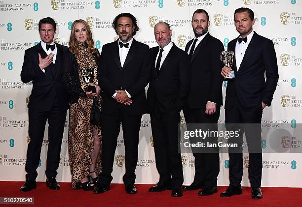 Tom Cruise poses with Best Film winners Mary Parent, Alejandro Gonzalez Inarritu, Steve Golin, Keith Redmon and Best Actor winner Leonardo DiCaprio...