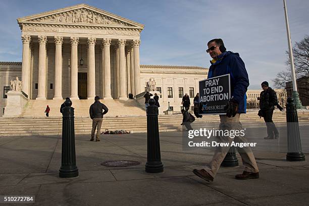 Visitors walk outside the U.S. Supreme Court following the death of Supreme Court Justice Antonin Scalia February 14, 2016 in Washington, DC. Supreme...