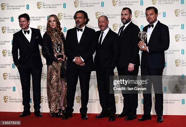 Tom Cruise poses with Best Film winners Mary Parent, Alejandro Gonzalez Inarritu, Steve Golin, Keith Redmon and Best Actor winner Leonardo DiCaprio...