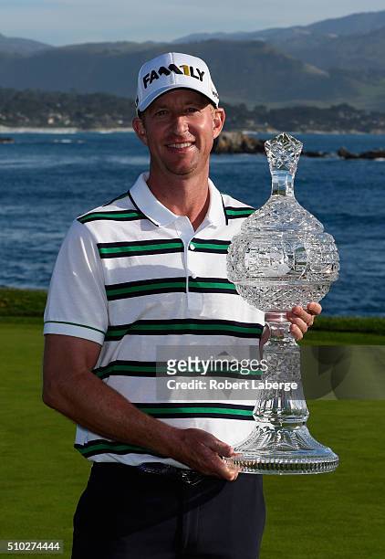 Vaughn Taylor poses with the trophy after winning the AT&T Pebble Beach National Pro-Am at the Pebble Beach Golf Links on February 14, 2016 in Pebble...