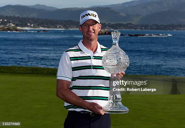 Vaughn Taylor poses with the trophy after winning the AT&T Pebble Beach National Pro-Am at the Pebble Beach Golf Links on February 14, 2016 in Pebble...