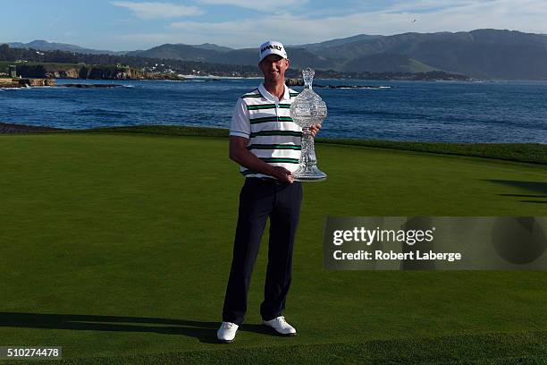 Vaughn Taylor poses with the trophy after winning the AT&T Pebble Beach National Pro-Am at the Pebble Beach Golf Links on February 14, 2016 in Pebble...