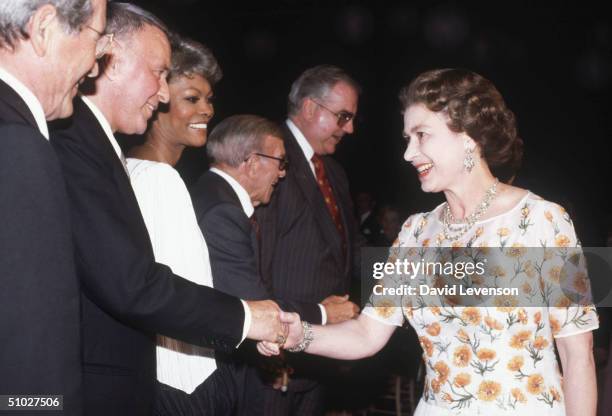 Queen Elizabeth II meeting singer Frank Sinatra at the studios of Twentieth Century Fox on February 27, 1983 in Long Beach, California, USA. From the...