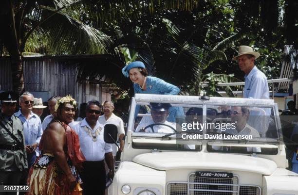 Queen Elizabeth II and Prince Philip, Duke of Edinburgh meeting locals while touring Funafuti, in Tuvalu during the Royal Tour of the South Pacific.
