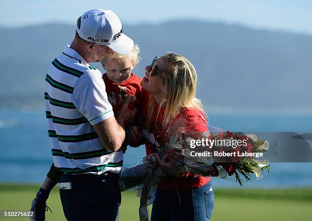 Vaughn Taylor celebrates with wife Leot and son Locklyn after winning the AT&T Pebble Beach National Pro-Am at the Pebble Beach Golf Links on...