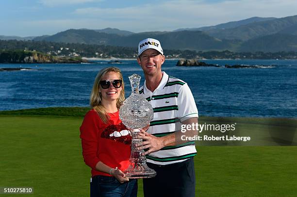 Vaughn Taylor and wife Leot pose with the trophy after winning the AT&T Pebble Beach National Pro-Am at the Pebble Beach Golf Links on February 14,...