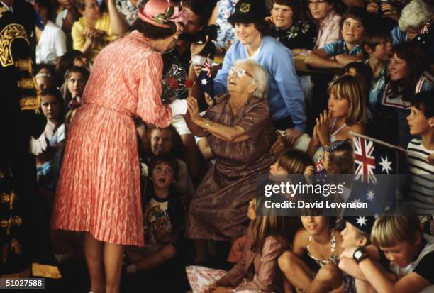 Queen Elizabeth II meeting 99 year old Dorothy Kennish during a walkabout through the Queen Street Mall on October 7, 1982 in Brisbane, Australia...