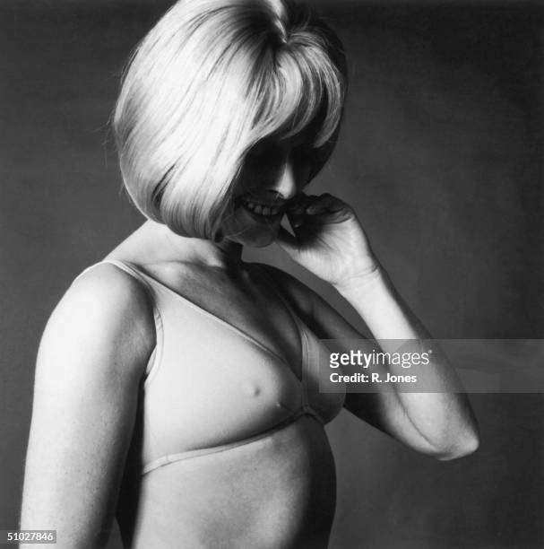 Blonde woman modelling a flesh coloured all stretch soft bra with a single back fastening, 6th April 1970.