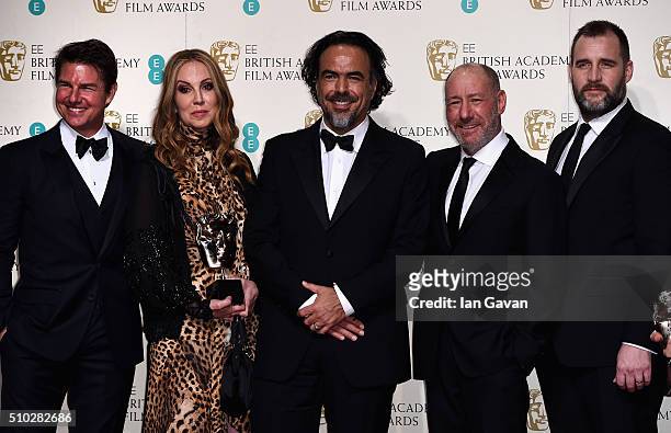 Tom Cruise poses with Best Film winners Mary Parent, Alejandro Gonzalez Inarritu, Steve Golin and Keith Redmon for 'The Revenant' in the winners room...
