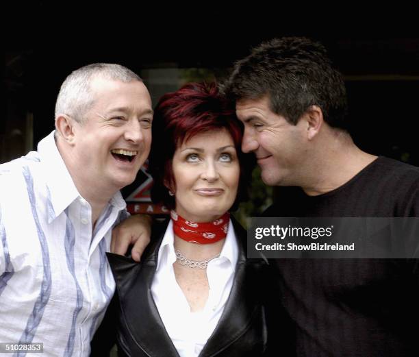 Louis Walsh, Sharon Osbourne and Simon Cowell pose for photos after auditioning hundreds of hopeful musicians for their new TV show "X Factor" on...