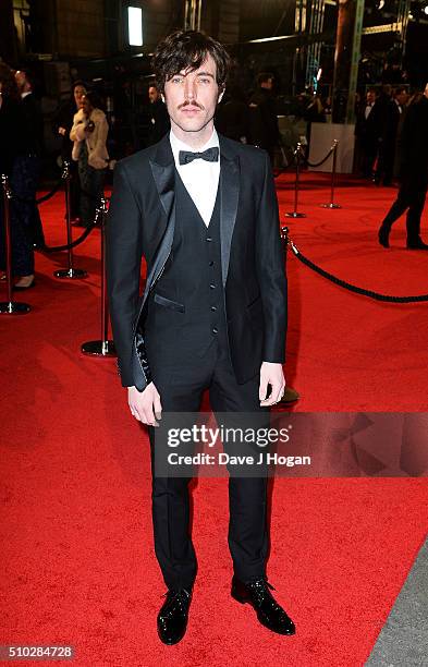 Tom Hughes attends the EE British Academy Film Awards at The Royal Opera House on February 14, 2016 in London, England.