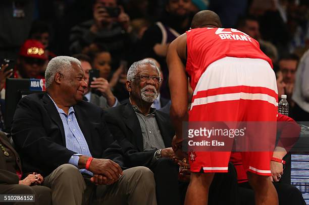 Kobe Bryant of the Los Angeles Lakers and the Western Conference speaks to NBA Hall of Famers Oscar Robertson and Bill Russell before the NBA...