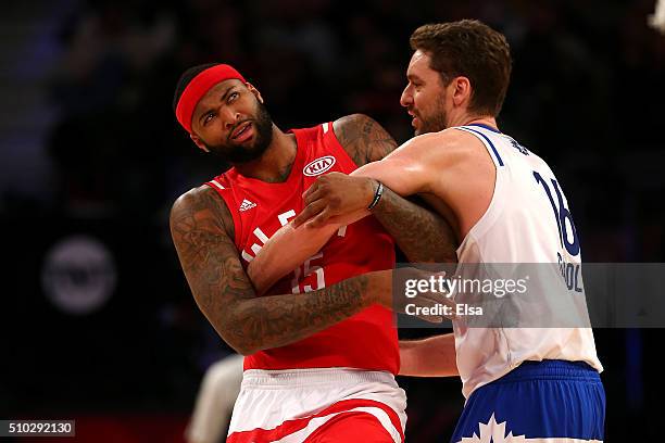 Pau Gasol of the Chicago Bulls and the Eastern Conference tangles up with DeMarcus Cousins of the Sacramento Kings and the Western Conference in the...