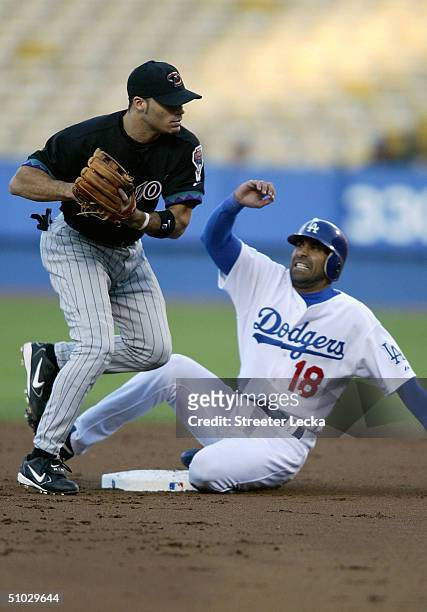 Jose Hernandez of the Los Angeles Dodgers slides into Scott Hairston of the Arizona Diamondbacks during the game on July 6, 2004 at Dodger Stadium in...