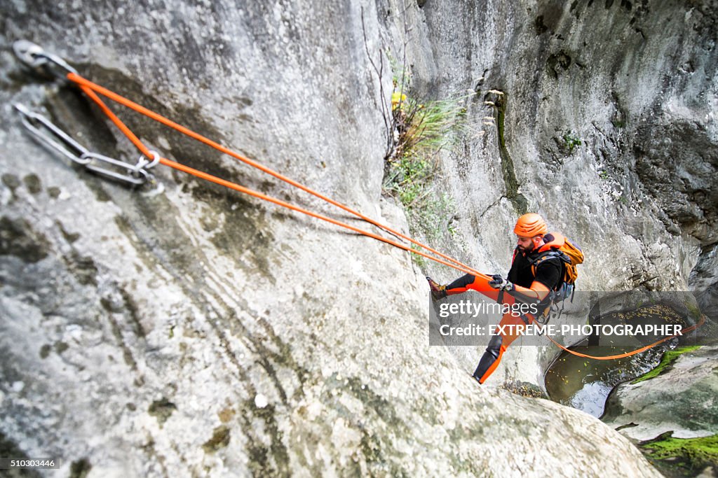 Rappeling down the cliff
